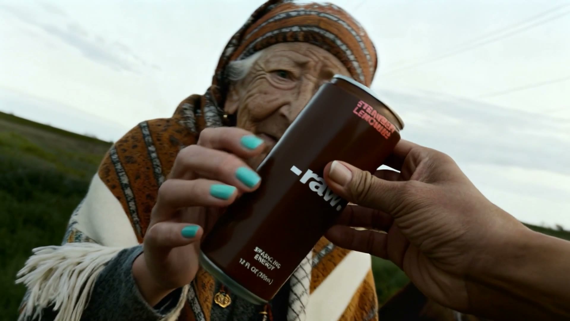 Hands gripping the can — close-up